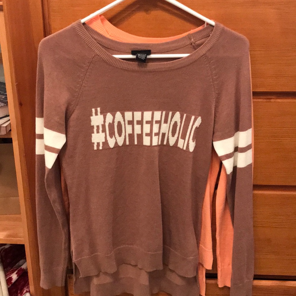 Two long sleeve shirts - one brown, one pink.